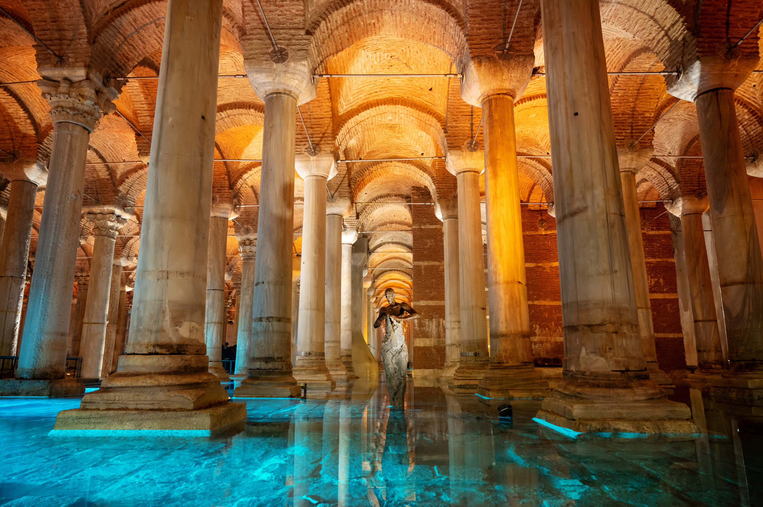 Interior view of the Basilica Cistern in Istanbul, Turkey. Ancient columns, water, illumination